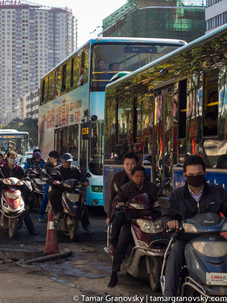 Exception to the Rule (most people who drive motorbikes in Kunming still do not wear masks - at least not in early 2014)